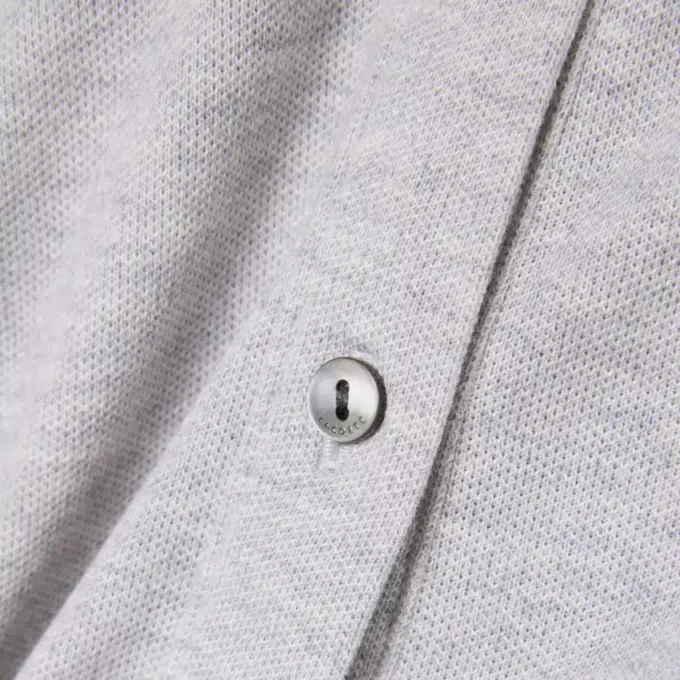 Tuta con colletto polo in piqué elasticizzato Tuta con colletto polo in piqué elasticizzato